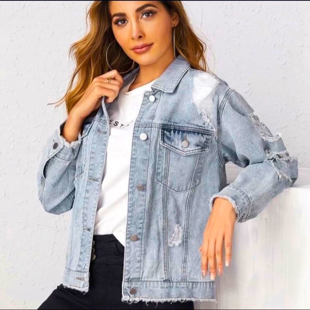 Brand new, and never worn ripped jean jacket!